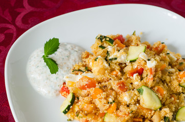Couscous with vegetables with yogurt sauce