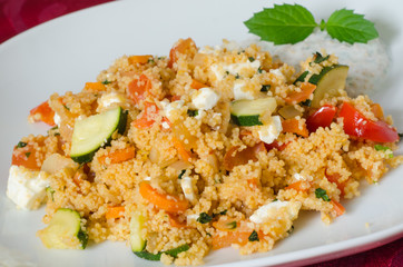 Couscous with vegetables with yogurt sauce