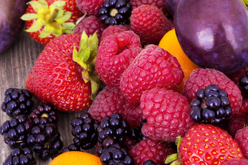 tasty summer fruits on a wooden table
