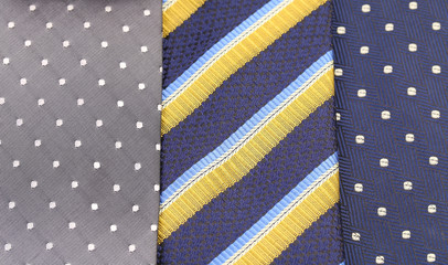 Background of three  multi-colored tie.