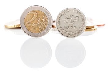 2 Euro coin next to 2 kuna coin - Croatian currency