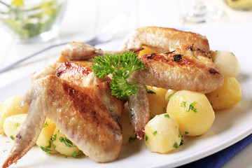 Roasted chicken wings and potatoes