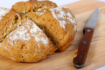 Newly-baked bread and a knife