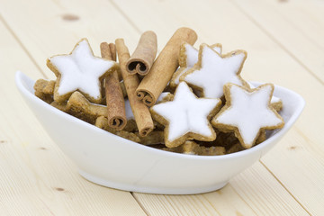 typical christmas cinnamon star cookies and cinnamon sticks