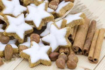 typical christmas cinnamon star cookies, nuts and cinnamon stick