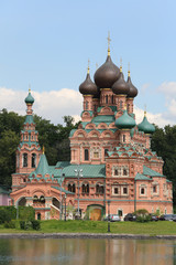 Temple of Trinity in Ostankino near pond at summer day