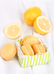 Macaroons on white cloth close-up