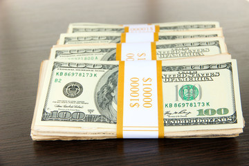 Stacks of money on wooden table
