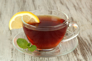Cup of tea with lemon on table close-up