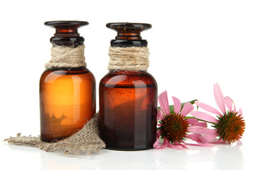 Medicine bottles with purple echinacea, isolated on white