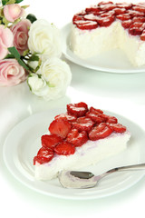 Cheesecake with fresh strawberry on white plate closeup