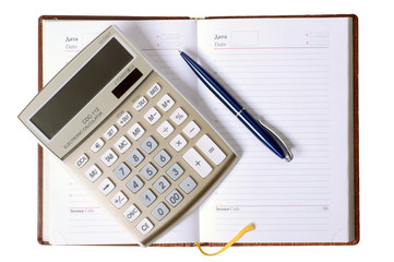 notebook with pen and calculator