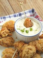 Fried cornmeal-crusted chicken bites with yogurt herb dressing.