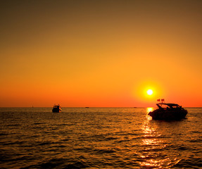 Boat in the sunset near Koh Phi Phi of Thailand