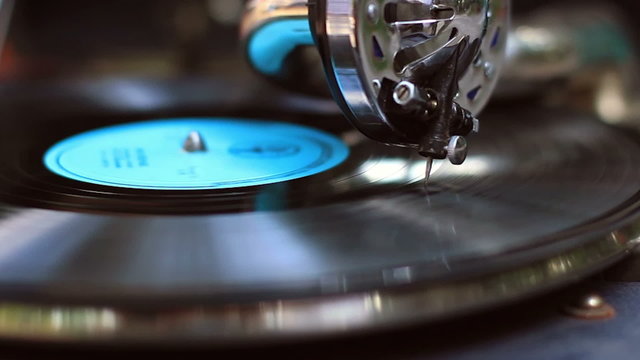 Retro gramophone playing, big fashionable needle scrapes record