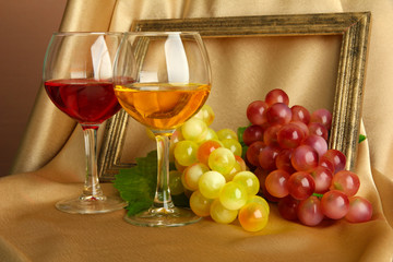 composition of frame,wine and grapes on bright background