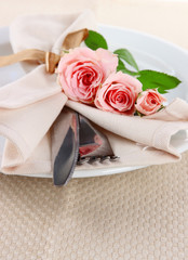 Served plate with napkin and rose close-up