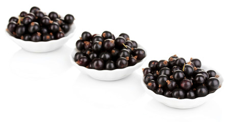 Fresh black currant isolated on white