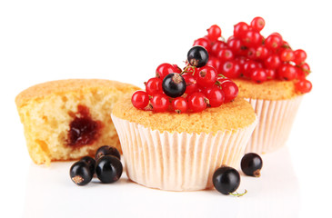 Tasty muffins with berries isolated on white