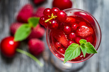 Closeup of liqueur made of wild berries and mint