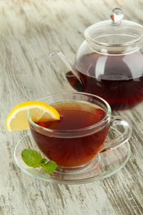 Cup of tea with lemon on table close-up