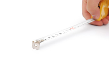 hand holding a tape measure on white