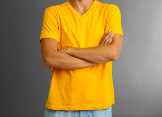 T-shirt on young man, on grey background