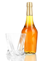 Glass of whiskey with bottle, isolated on white
