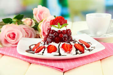 Tasty jelly dessert with fresh berries, on bright background