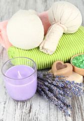 Still life with lavender candle, soap, massage balls, soap and