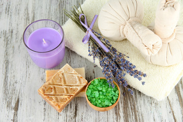 Obraz na płótnie Canvas Still life with lavender candle, soap, massage balls, soap and