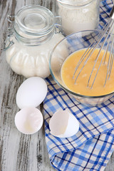 Ingredients for dough on wooden table close-up