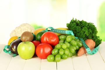 Fresh vegetables on table on light background