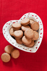Heart shaped plate with homemade cookies, selective focus