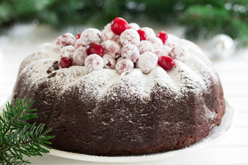 Chocolate cake with cranberries, new year, Christmas.