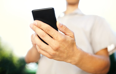 Close up of a man using mobile smart phone