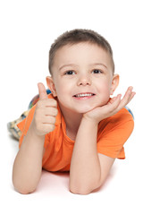 Smiling boy holds his thumb up - 54986950