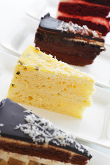 A row of cakes of different flavors