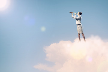 Business woman with telescope