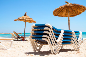 Deck chairs and parasol on the beach