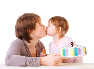 Obraz na płótnie Canvas Little daughter kissing her mother.