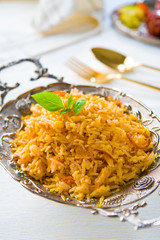 Biryani rice or briyani rice, curry chicken and salad, tradition