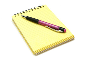 Block with pen isolated on a white background