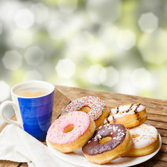 coffee mug and plate of donuts