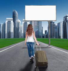 woman walking on the road to the city, in front of an empty Bill