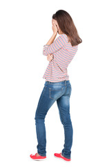 Back view of shocked woman in blue jeans. upset young brunete gi