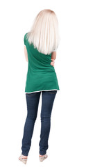 back view of standing young beautiful  blonde woman.