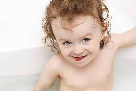 Little baby devil playing in bath