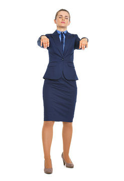 Full Length Portrait Of Business Woman Walking Like Zombie