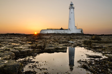 Reflected St Marys Lighthouse at sunset